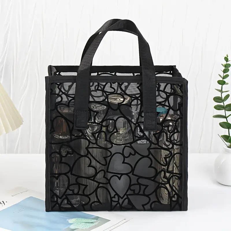 Bolso negro de corazones